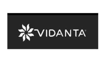 Logo of Vidanta with a flower-like symbol and text.